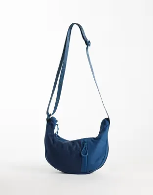 gym crossbody sling bag with utility mesh pocket in deep blue