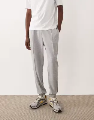 slim fit joggers with pintucks in light grey