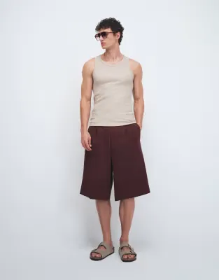 tailored pleated oversized bermuda shorts in burgundy