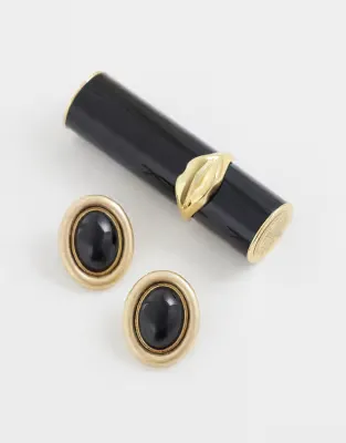 stud earrings with black resin stone set in brushed gold tone