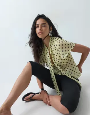 short sleeve top with keyhole detail in yellow spot