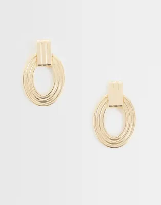large door-knocker earrings in gold tone