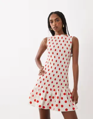 shirred drop waist mini dress in cream and red spot