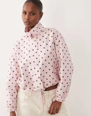 scallop detail rain jacket in pink polka dot