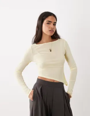 sheer long sleeve top with asymmetric hem in buttermilk