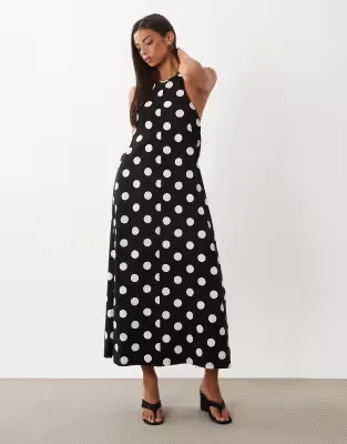 polka dot trapeze midi dress in black and white