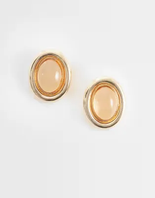 stud earrings with stone set design in amber