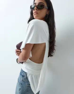 one sleeve top with asymmetric drape detail in white