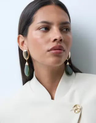 pendant drop earrings with green resin in gold tone