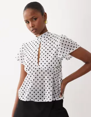 floaty mesh flutter sleeve top with tie back detail in mono polka dot