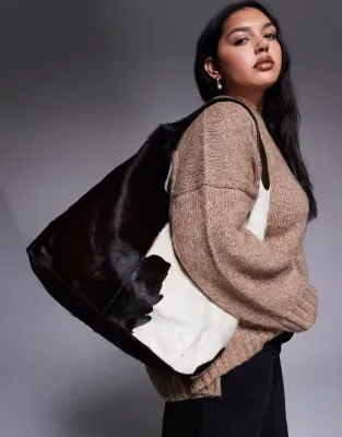 cow print leather 'hair on' slouch bag in dark brown