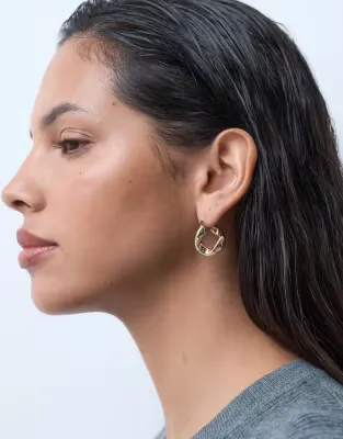 small hoops with twisted design in gold tone