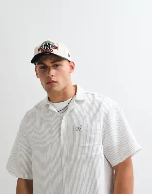 oversized pinstripe revere shirt with back print in white